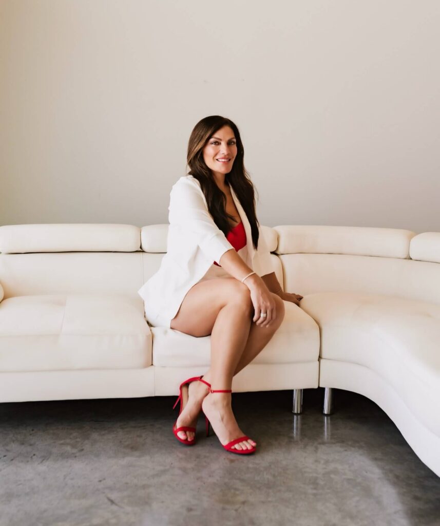 Deanna the radiant injector sitting on the couch at radiant aesthetics waiting for laser hair removal